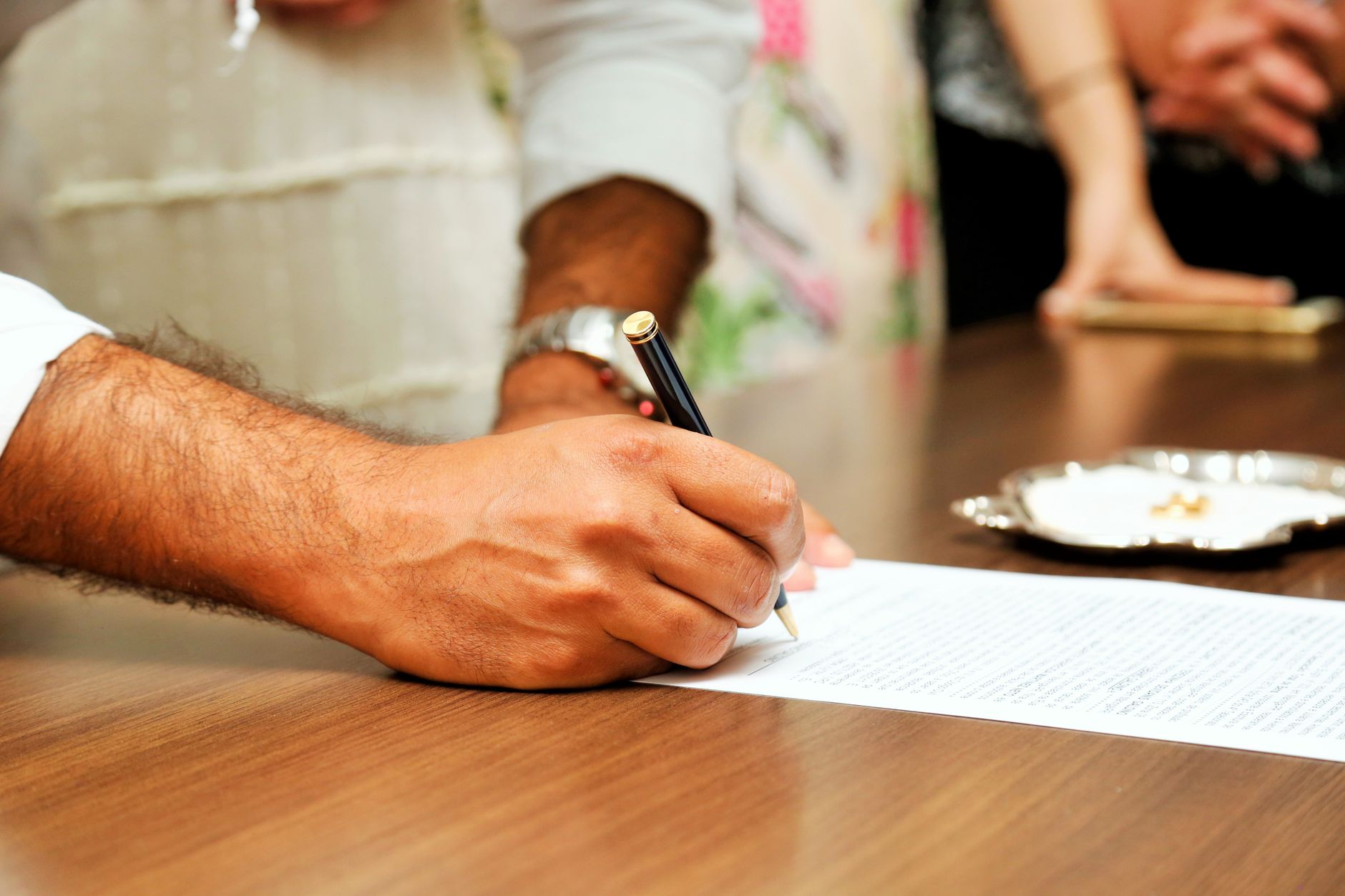couple signing real estate papers with notary