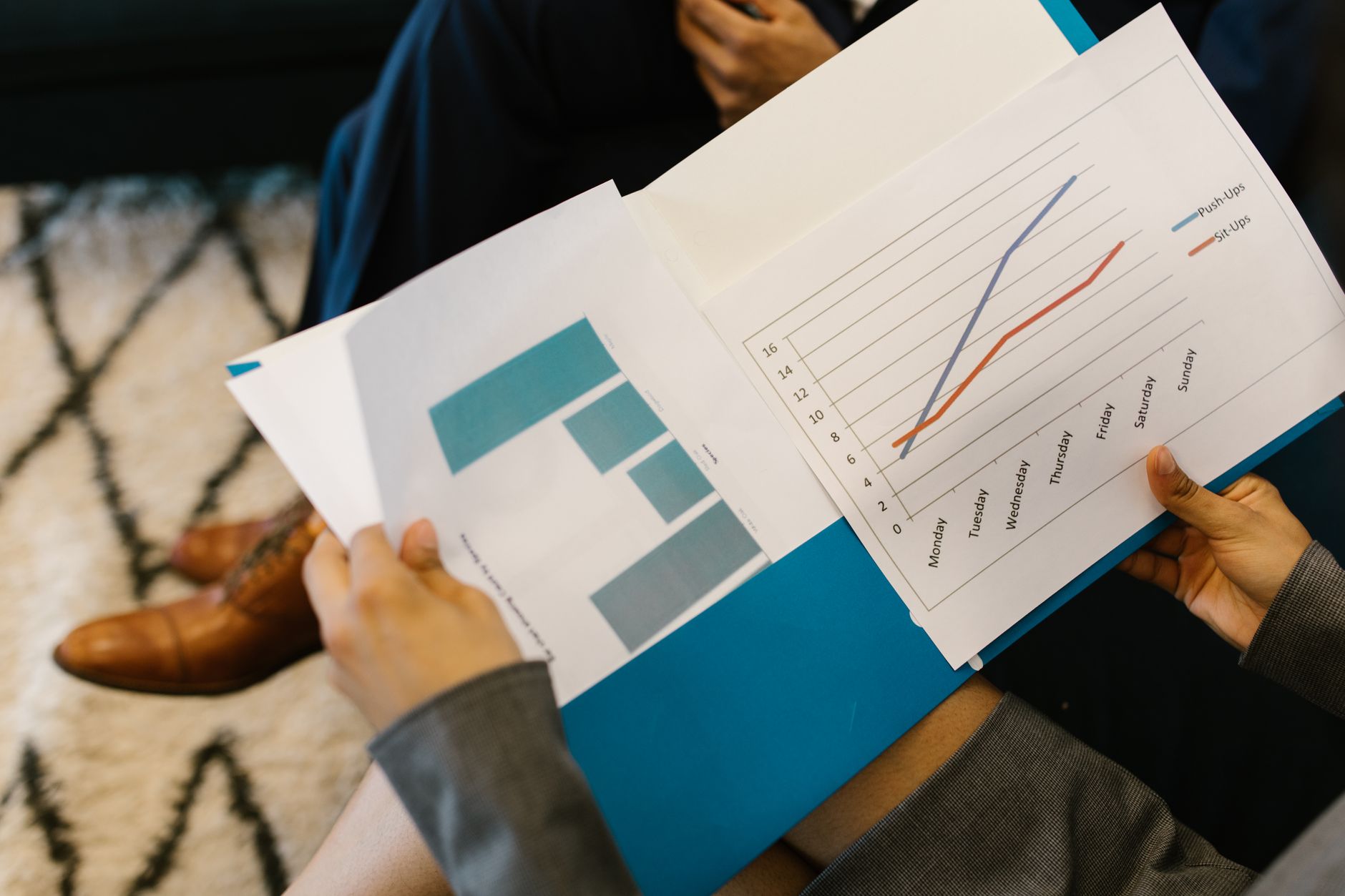 diverse financial charts and graphs with people in background