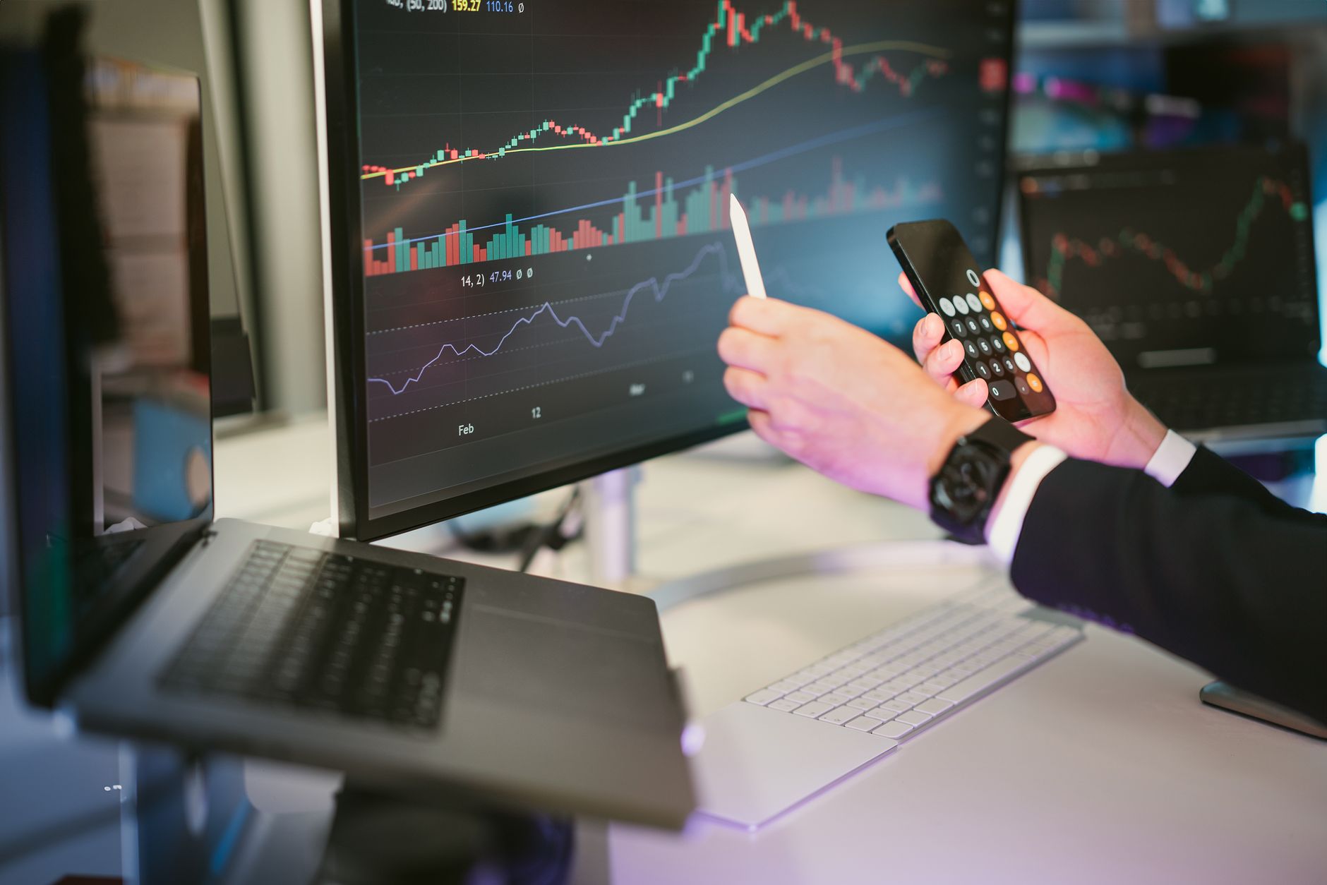 investor analyzing financial data on screen
