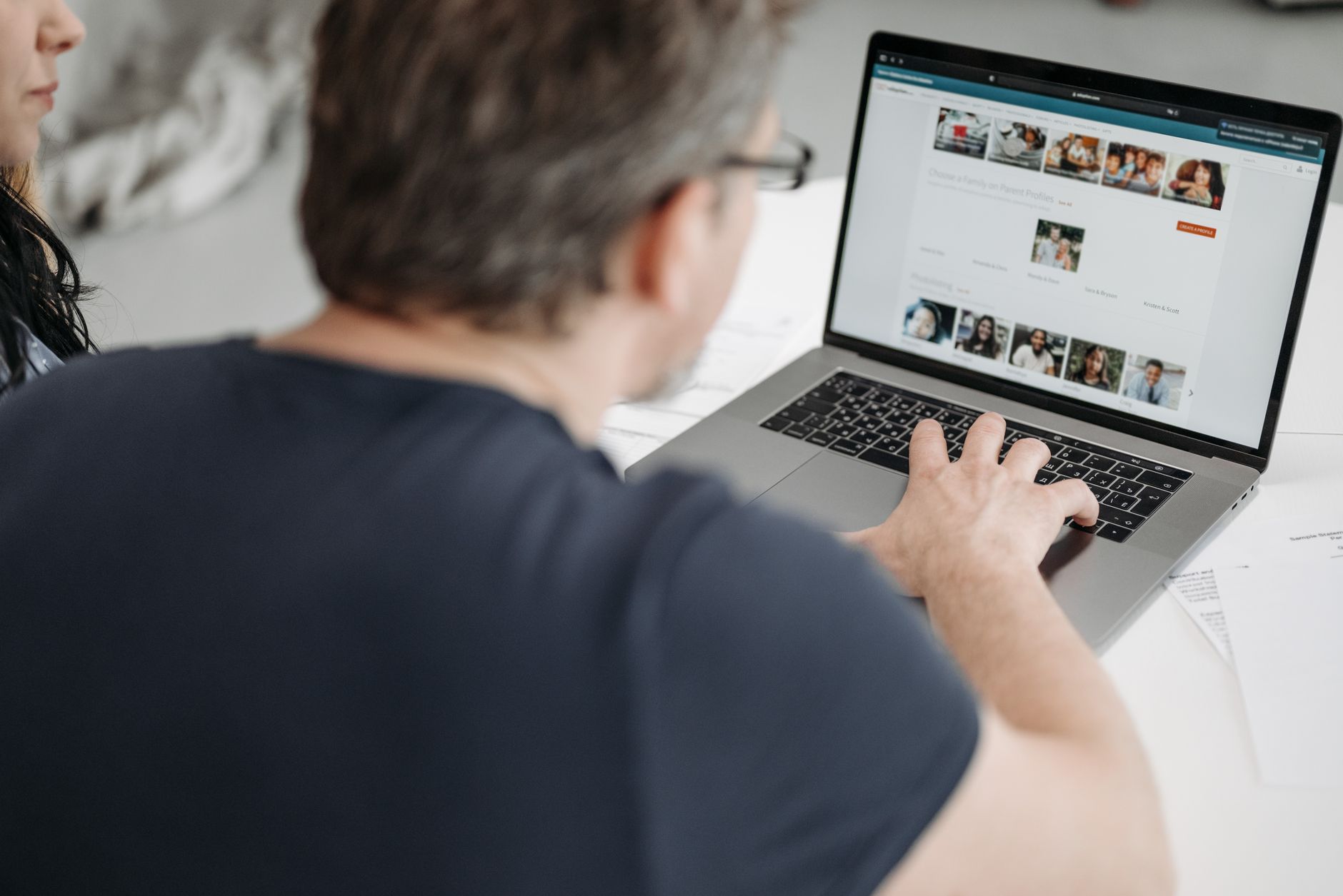 person searching for a house on a laptop, close-up on screen