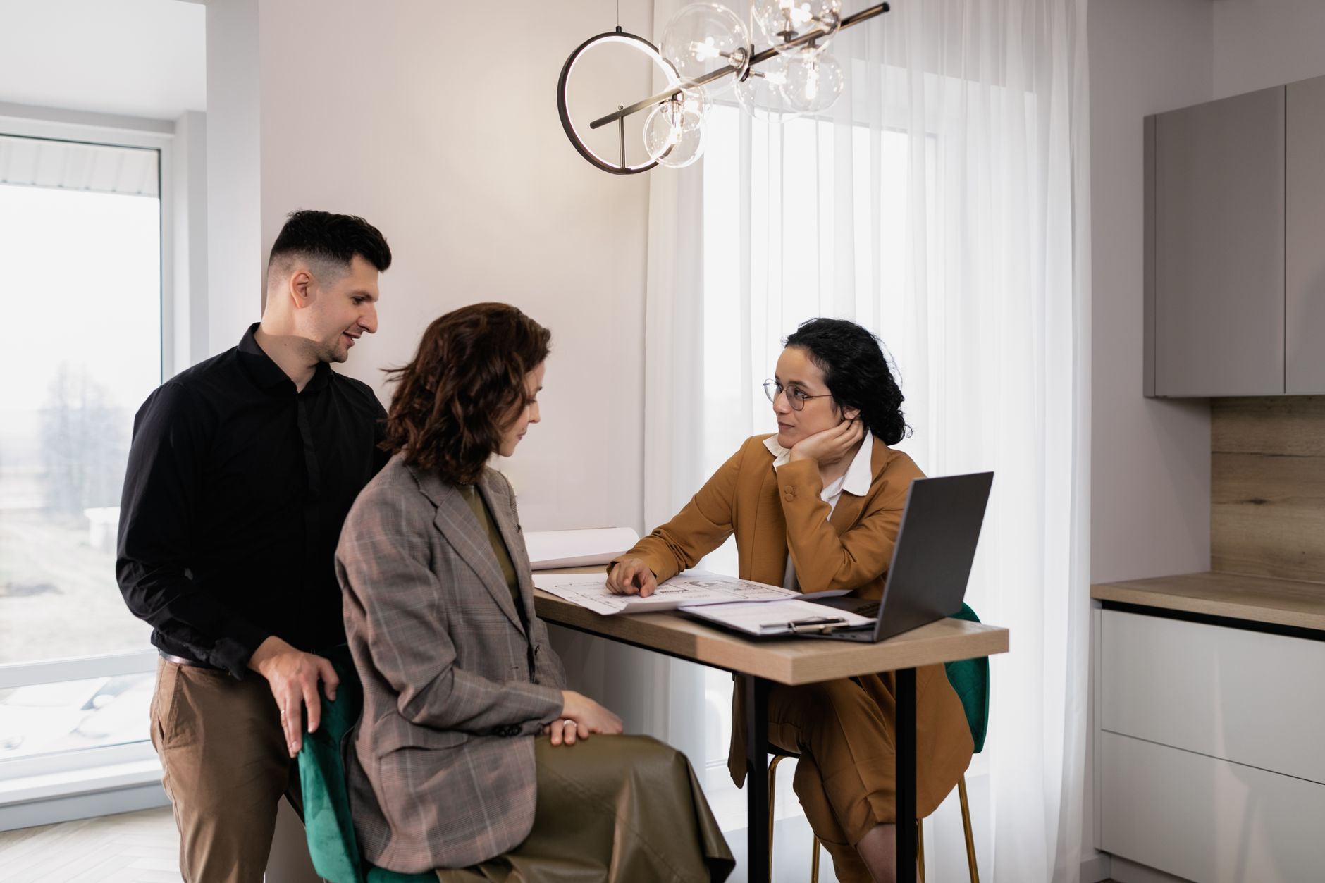 real estate agent explaining online platform to a client