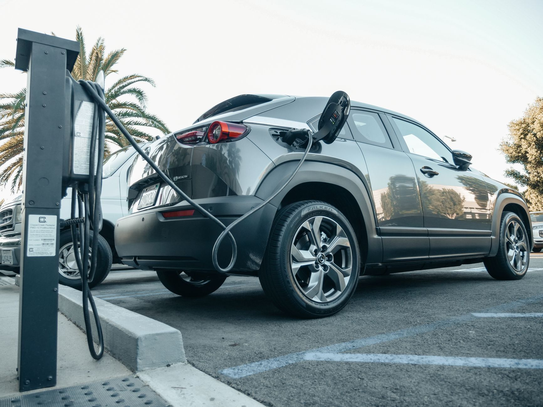 modern car on highway, electric vehicle charging