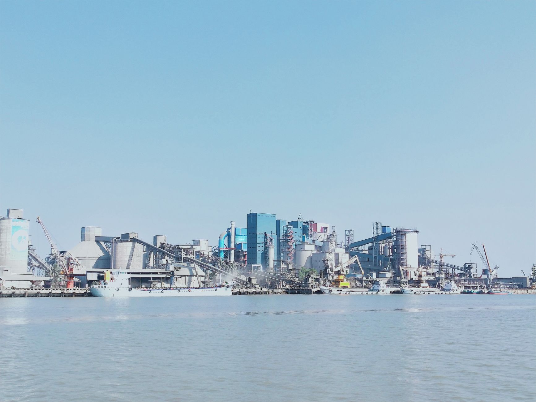 modern factory China, industrial landscape, port activity Shandong