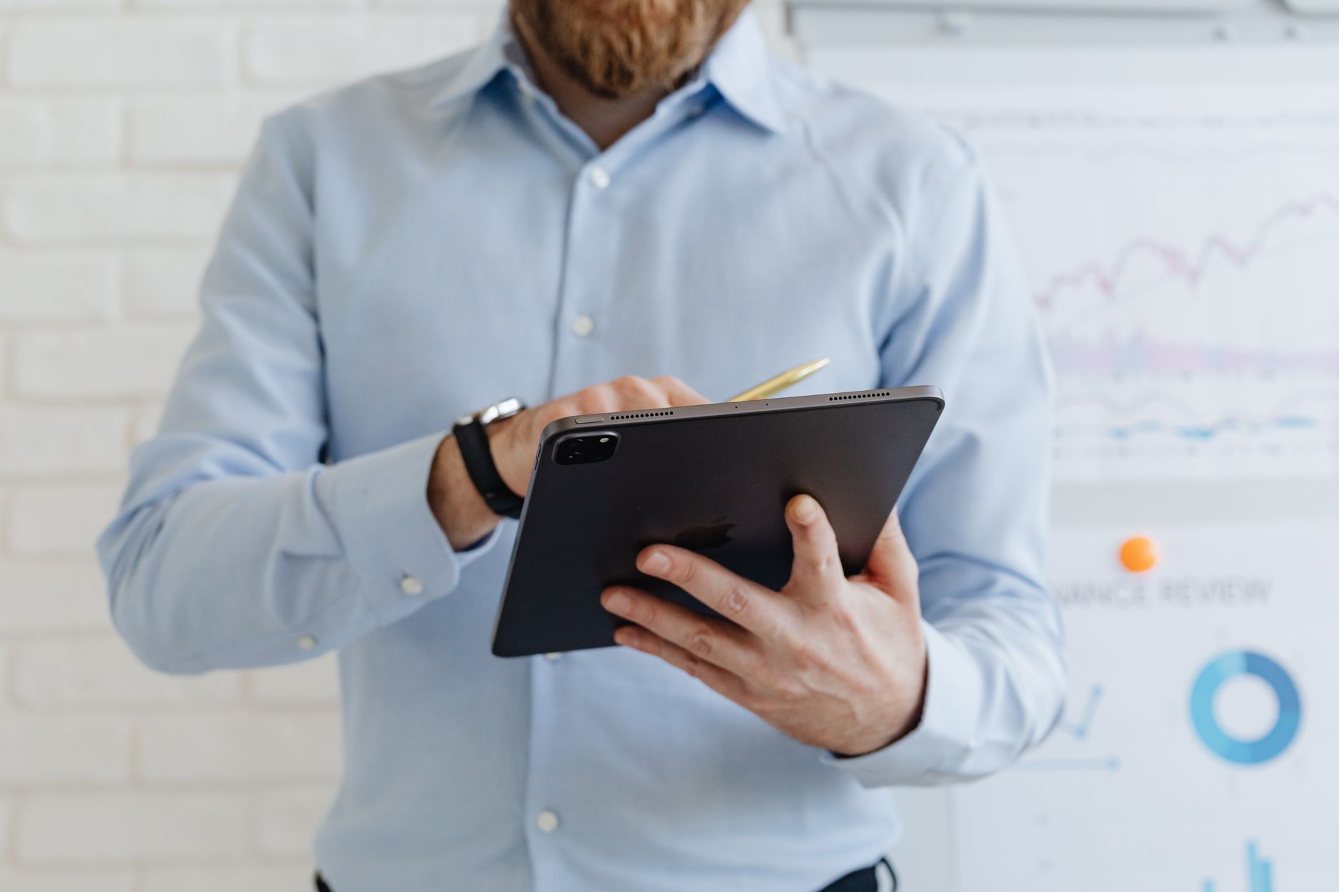 modern office worker looking at tablet with digital documents