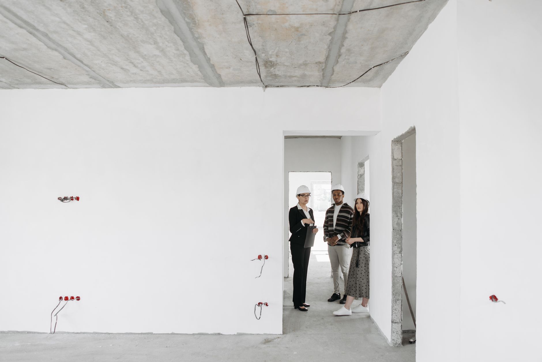 professional renovation workers discussing plans on site
